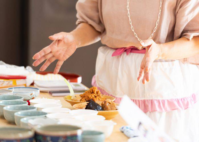 A host showing someone how cook Japanese dishes.